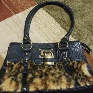 Cheetah  print purse with a lock on it